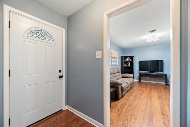 entrance foyer featuring hardwood / wood-style flooring