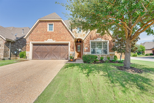 view of front of home featuring a front yard and a garage