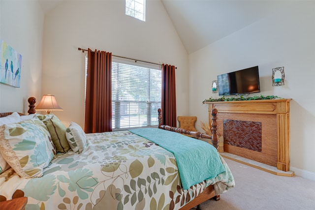 bedroom with high vaulted ceiling and carpet floors