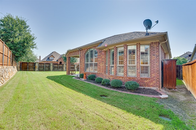 back of house featuring a yard