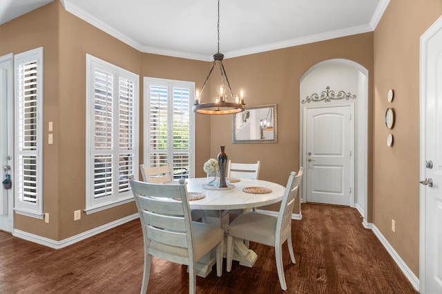 dining room featuring an inviting chandelier, dark hardwood / wood-style floors, and ornamental molding