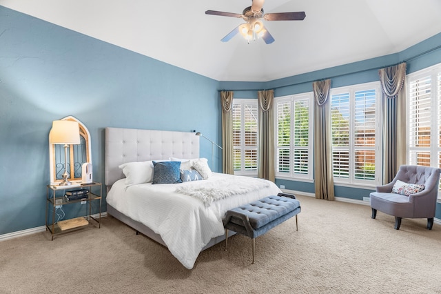 carpeted bedroom with ceiling fan and lofted ceiling