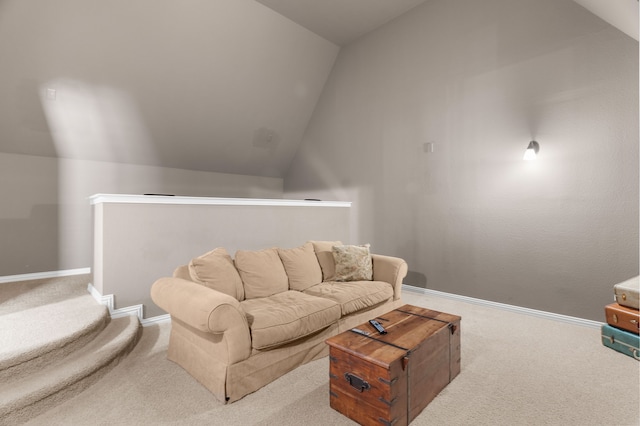 carpeted living room featuring lofted ceiling