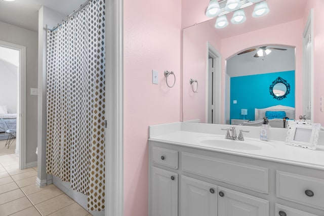 bathroom featuring tile patterned floors, ceiling fan, a shower with shower curtain, and vanity