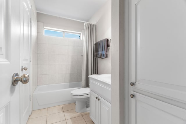 full bathroom featuring tile patterned floors, vanity, toilet, and shower / bathtub combination with curtain