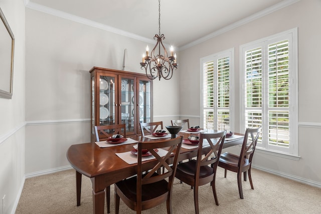 carpeted dining room with a chandelier and ornamental molding