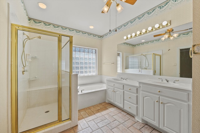 bathroom featuring ceiling fan, vanity, and shower with separate bathtub