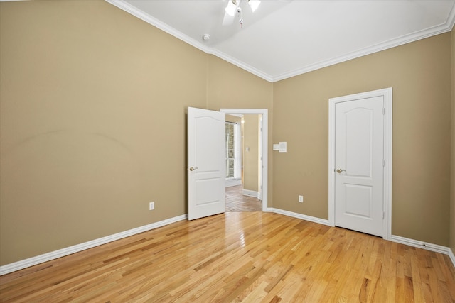 unfurnished room featuring crown molding and light hardwood / wood-style floors