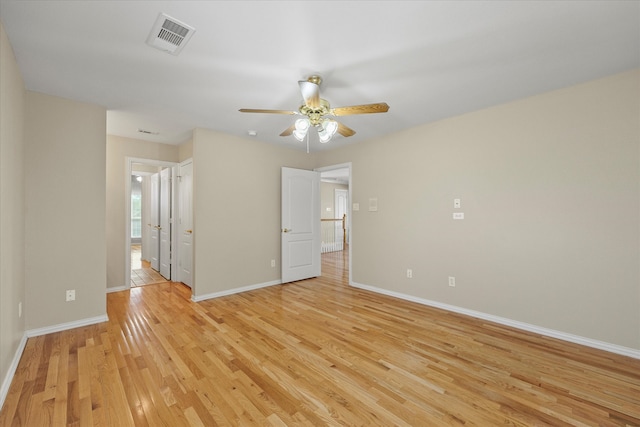 spare room featuring light hardwood / wood-style floors and ceiling fan