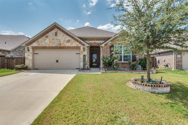 view of front of home featuring a garage and a front lawn