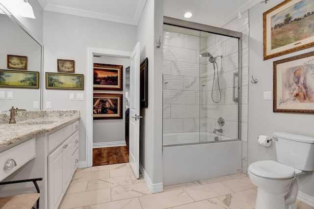 full bathroom featuring vanity, toilet, crown molding, and enclosed tub / shower combo