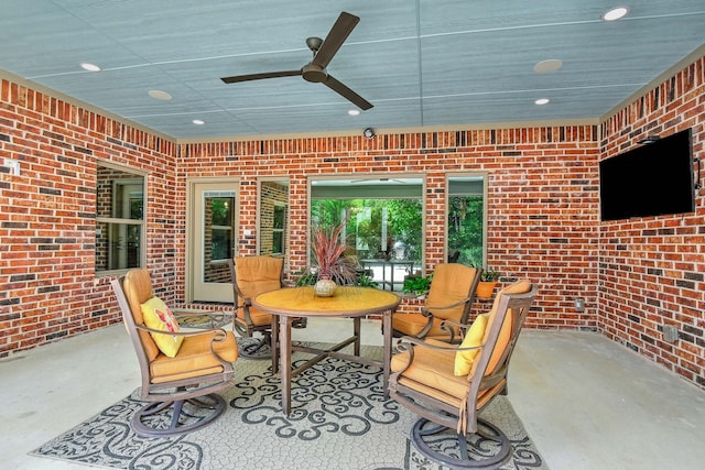 view of patio featuring ceiling fan