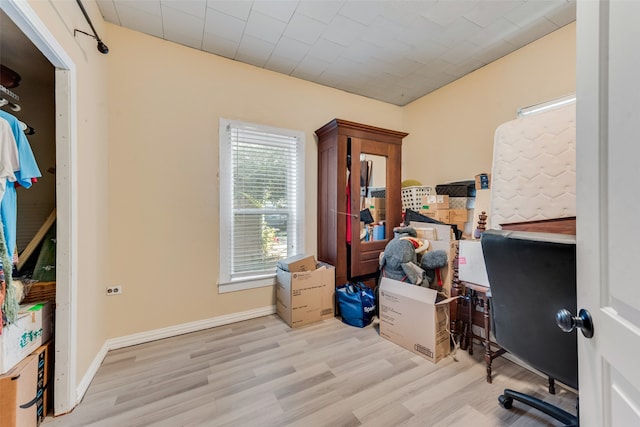 office with light wood-type flooring