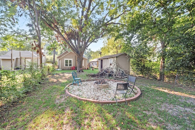 view of yard with an outdoor fire pit