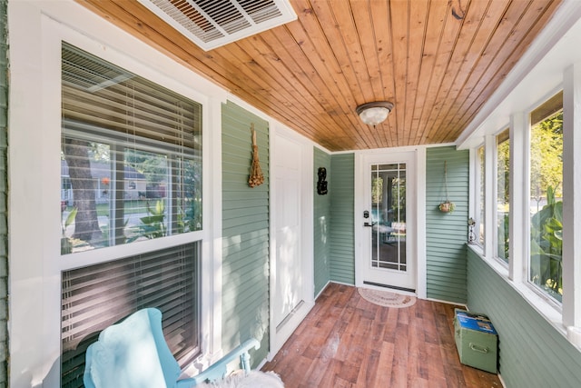 sunroom featuring wooden ceiling