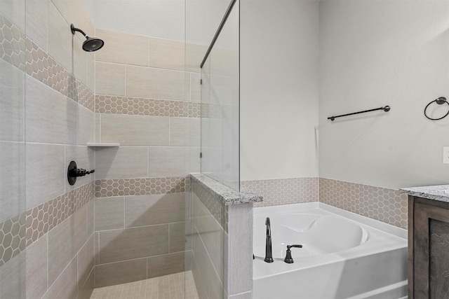 bathroom with shower with separate bathtub