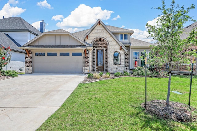 view of front of house with a garage and a front yard