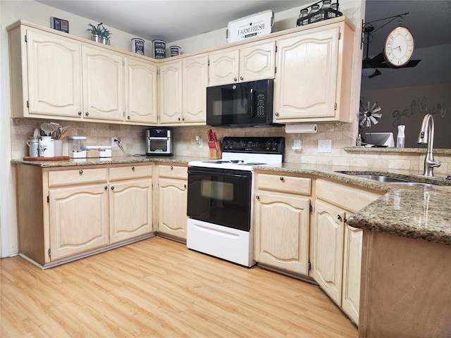 kitchen featuring backsplash, dark stone countertops, sink, electric range, and light hardwood / wood-style floors