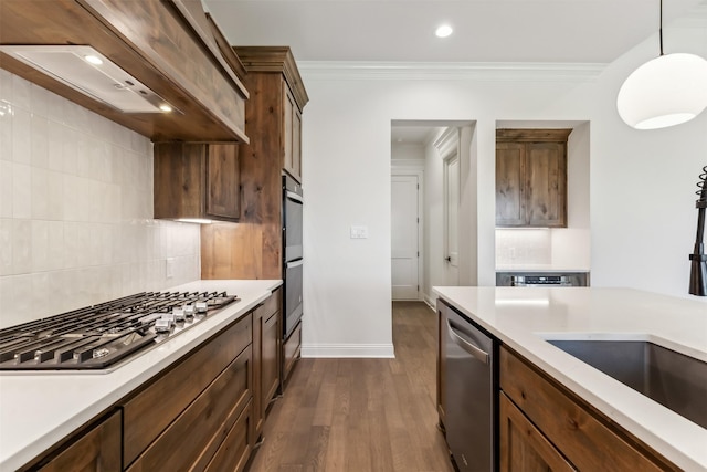 kitchen with backsplash, premium range hood, hanging light fixtures, dark hardwood / wood-style flooring, and stainless steel appliances