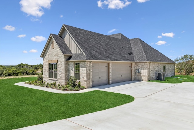 view of home's exterior featuring a garage, central AC unit, and a lawn