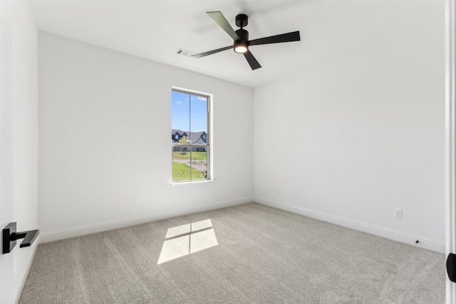 unfurnished room featuring light carpet and ceiling fan