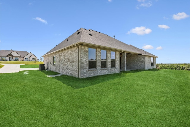 view of home's exterior with a yard and cooling unit