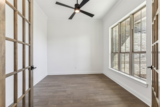 unfurnished room featuring ceiling fan, french doors, dark wood-type flooring, and ornamental molding