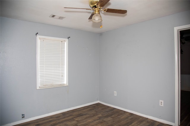 empty room with ceiling fan and wood-type flooring