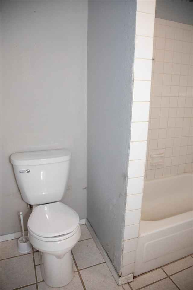 bathroom with tile patterned floors and toilet