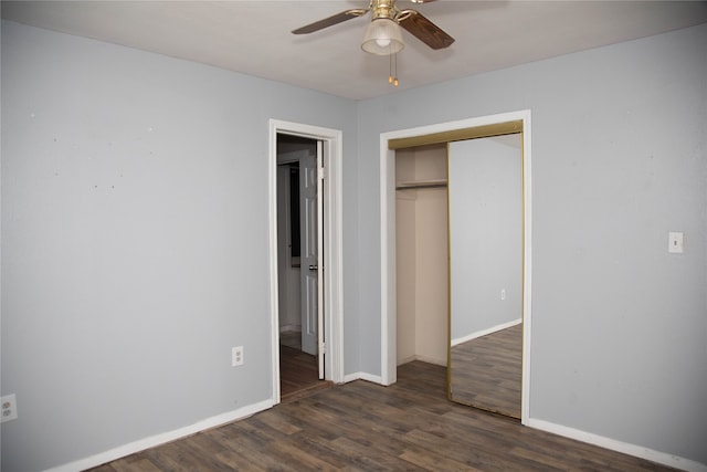 unfurnished bedroom featuring a closet, dark hardwood / wood-style flooring, and ceiling fan