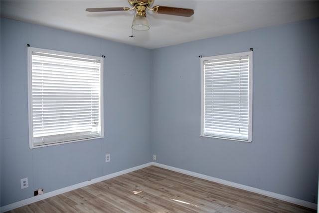 unfurnished room featuring ceiling fan and light hardwood / wood-style floors