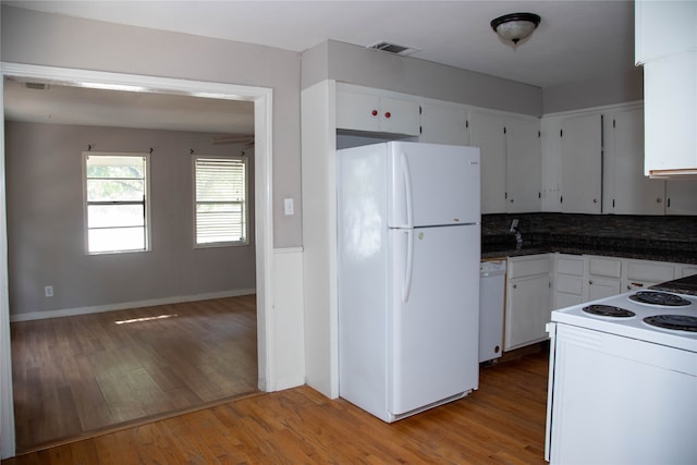 kitchen featuring white cabinets, white appliances, and light hardwood / wood-style floors