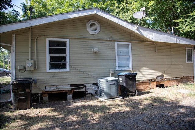 back of house with cooling unit