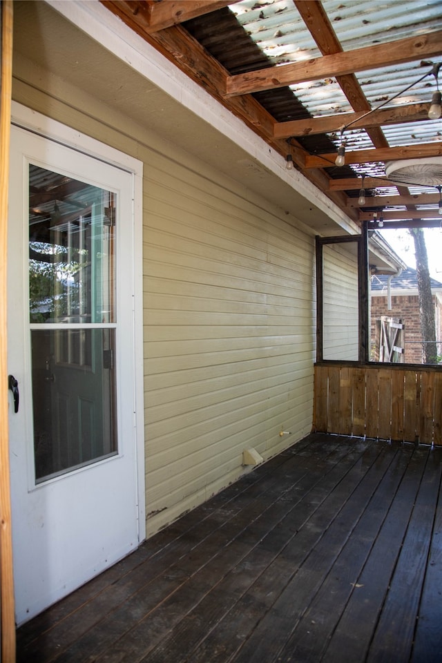 unfurnished sunroom featuring beam ceiling and coffered ceiling