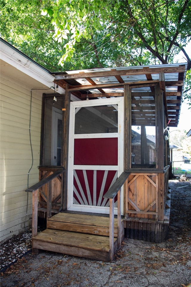 doorway to property featuring a pergola