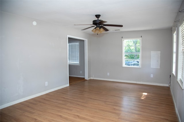 unfurnished room featuring ceiling fan and light hardwood / wood-style flooring