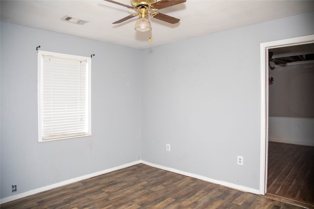 spare room with hardwood / wood-style floors and ceiling fan