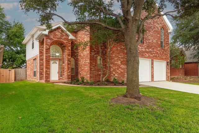 view of front of home with a garage and a front lawn