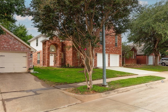 view of front facade with a front yard and a garage