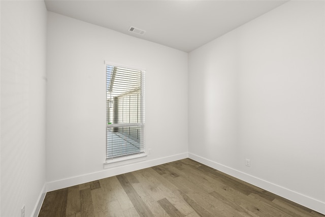 spare room featuring hardwood / wood-style flooring