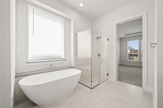 bathroom featuring independent shower and bath and tile patterned floors