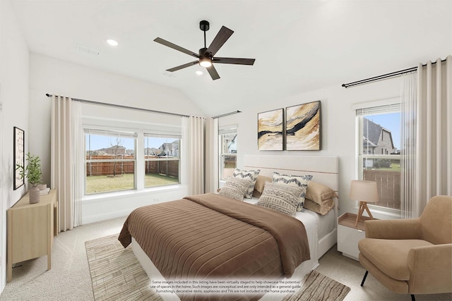 carpeted bedroom featuring ceiling fan and lofted ceiling