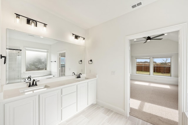 bathroom featuring ceiling fan, lofted ceiling, shower with separate bathtub, and vanity