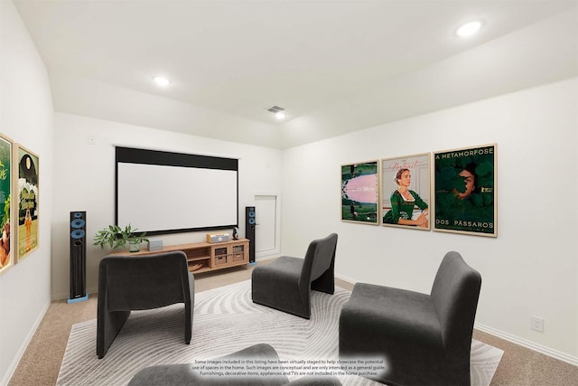 home theater with lofted ceiling and light colored carpet