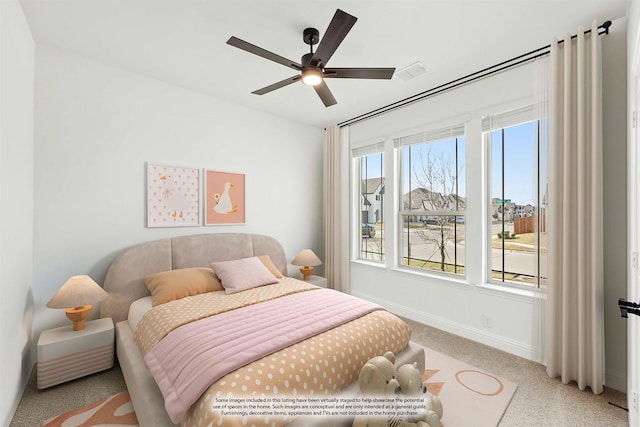 bedroom featuring ceiling fan and light colored carpet