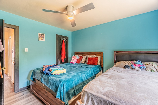 bedroom featuring hardwood / wood-style floors and ceiling fan