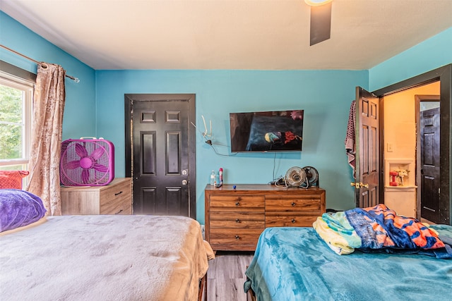 bedroom featuring ceiling fan and wood-type flooring