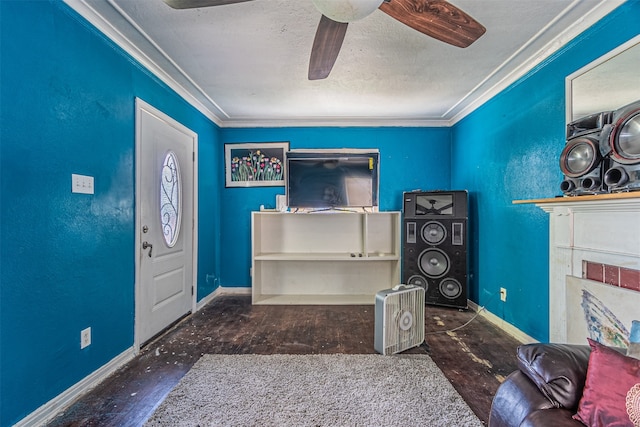 foyer with ceiling fan, dark hardwood / wood-style flooring, ornamental molding, and a textured ceiling