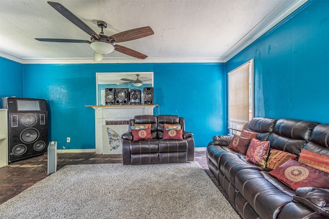 living room featuring crown molding, a textured ceiling, ceiling fan, tile patterned floors, and a fireplace