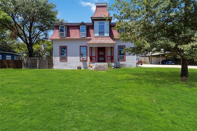 view of front of property featuring a front lawn and a carport